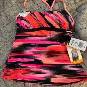 NWT size xs (6) ZeroXposur woman’s tankini top. Orange, pinks, navy. UPF 30